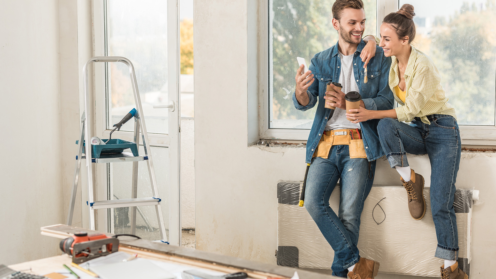 Picture of a couple working on a kitchen home improvement project.